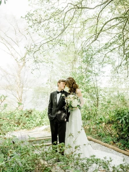 A couple on a wooded path in spring