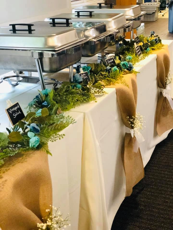 A table runner of greenery laid the morning of the party
